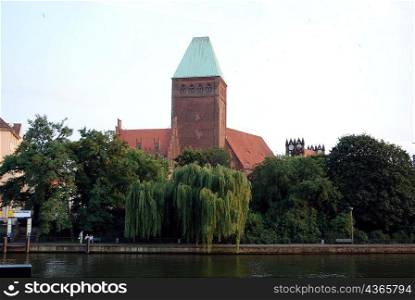 Red brick church across river, Berlin