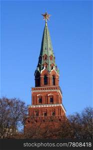 Red brick tower and tree in Kremlin, Moscow, Russia