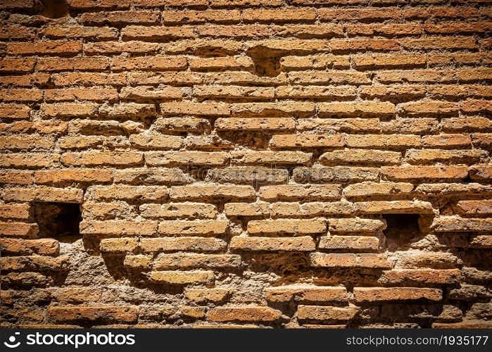 Red brick wall texture grunge background with vignette corners to interior design. Red brick wall texture