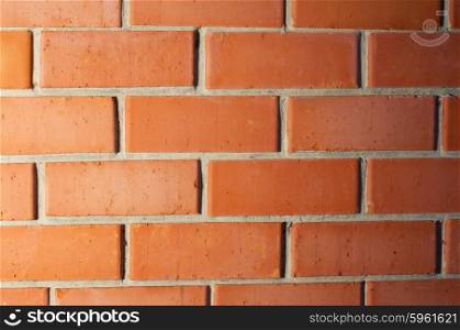 Red brick wall with gradient light background