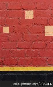 red brick wall with yellow spots