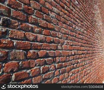 Red bricks. Red brick wall useful as a background - selective focus