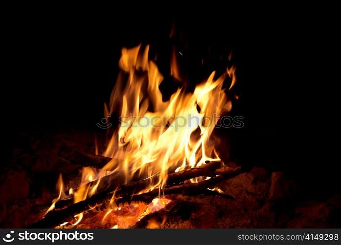 Red bright campfire with the black background