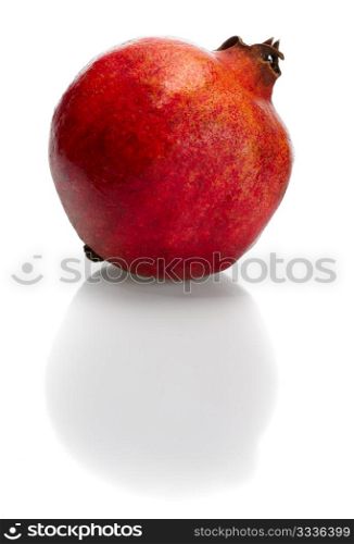 Red bright pomegranate on white background, isolated.