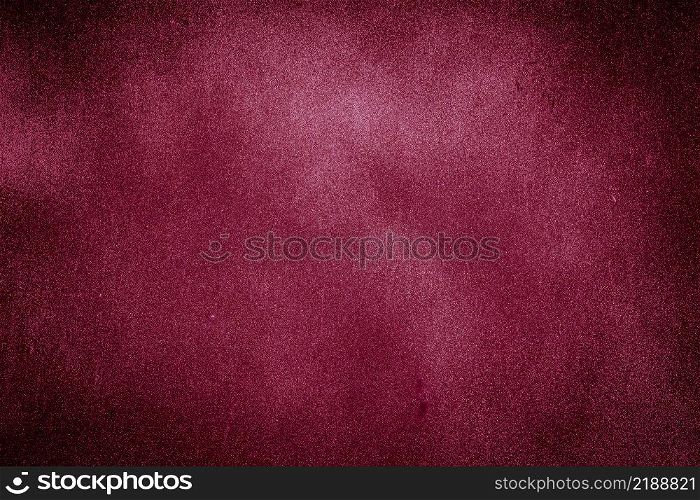 Red burgundy texture background with bright center spotlight