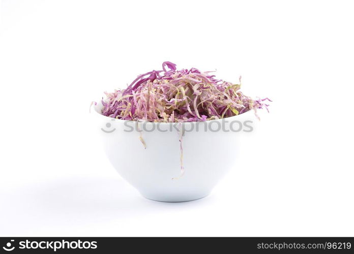 Red cabbage in bowl on white