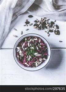 Red cabbage salad with beetroot, chives and various seeds