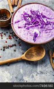 Red cabbage soup.Vegetable soup with spice.Autumn cuisine.. Red cabbage soup