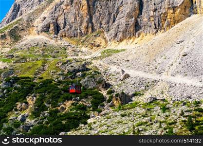 Red Cable Cars of the mount Lagazuoi carrying passenger up to the Rifugio Lagazuoi