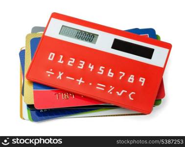 Red calculator and plastic credit cards isolated on white