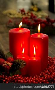 Red candles for Christmas with a beautiful decoration