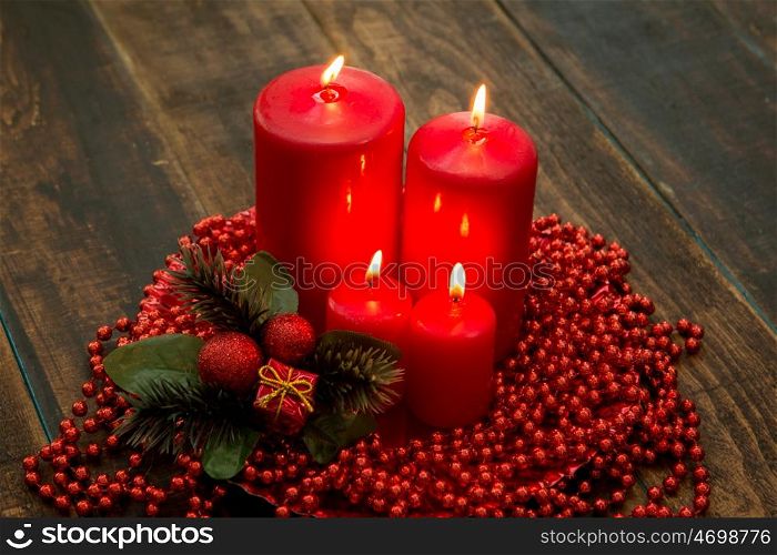 Red candles for Christmas with a beautiful decoration