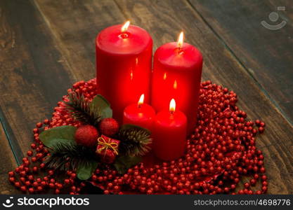 Red candles for Christmas with a beautiful decoration