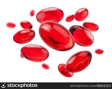 Red capsules levitate on a white background.. Red capsules levitate on a white background