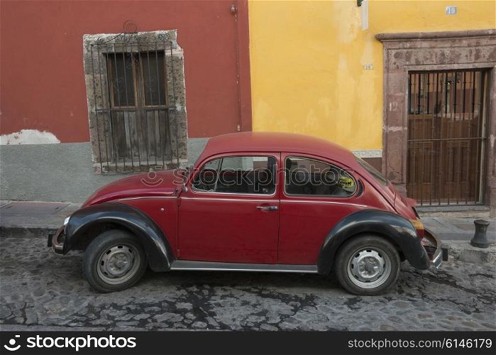 Red car on a street, Zona Centro, San Miguel de Allende, Guanajuato, Mexico