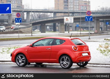 Red car view from side near the bridge, Riga, Latvia 