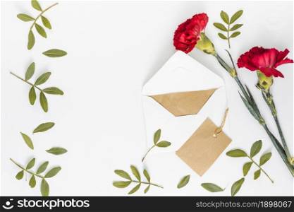 red carnation flowers with envelope paper. Resolution and high quality beautiful photo. red carnation flowers with envelope paper. High quality beautiful photo concept