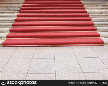 Red carpet. Red carpet on a stairway used to mark the route taken by heads of state, vips and celebrities on ceremonial and formal occasions or events