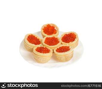 Red caviar in tartlets on plate, isolated on white background, high depth of field, studio shot