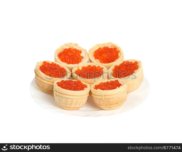 Red caviar in tartlets on plate, isolated on white background, studio shot
