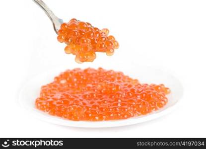 red caviar with spoon on a white background