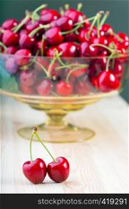 red cherry at the wooden table