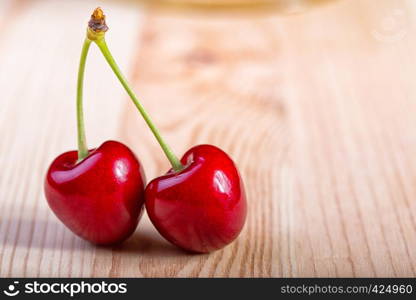 red cherry at the wooden table