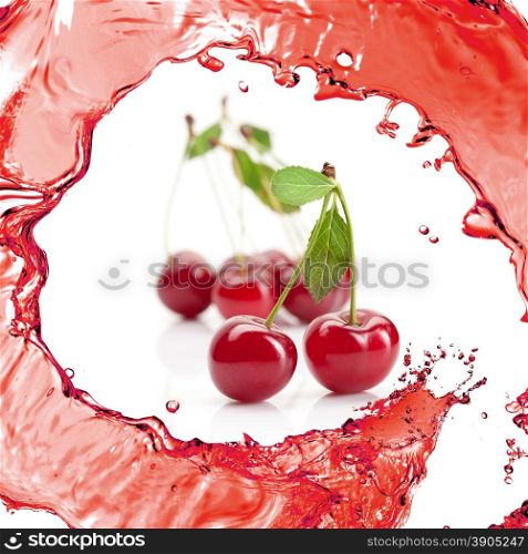 Red cherry with leaves and juice isolated on white