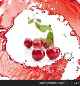 Red cherry with leaves and juice isolated on white