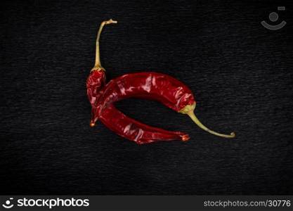 Red chili pepper, dried chillies on dark background