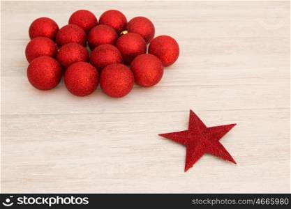 Red Christmas balls and star with glitter. Tree decorations