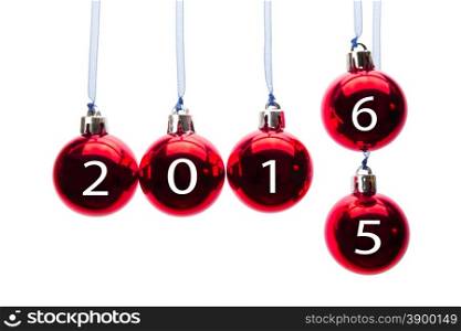 Red christmas balls or baubles with numbers of old year 2015 and new year 2016 isolated on white background