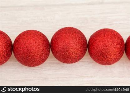 Red Christmas balls with glitter. Tree decorations