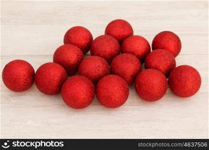 Red Christmas balls with glitter. Tree decorations