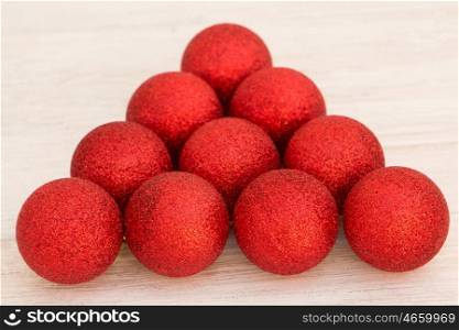 Red Christmas balls with glitter triangle shaped. Tree decorations