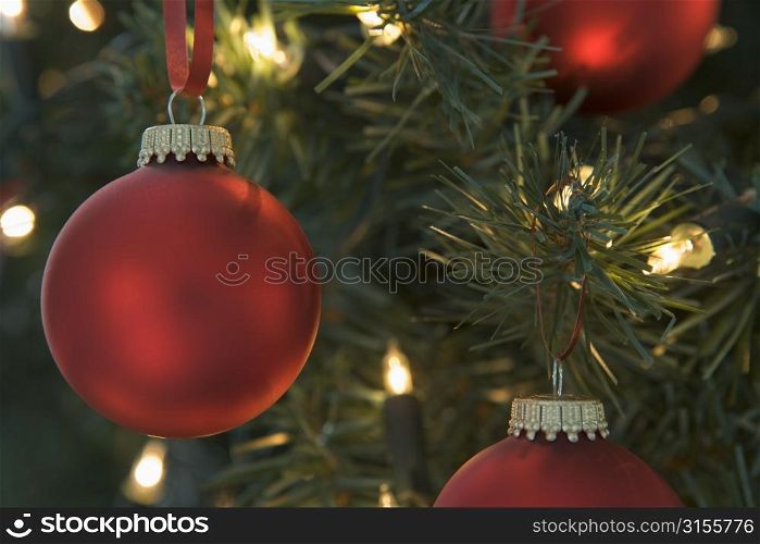 Red Christmas Baubles Hanging On Christmas Tree