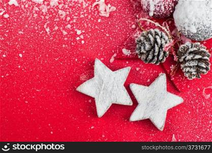 Red Christmas celebration card and christmas balls and star on snow
