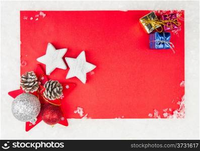 Red Christmas celebration card with small gift boxes and stars on snow