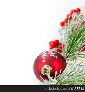 Red Christmas decoration with pine needles with copy space