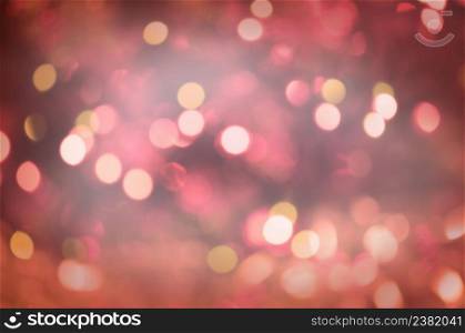 Red Christmas defocused abstract background vintage. Red glitter vintage lights textured background. Red Christmas glitter lights background. Defocused abstract red background