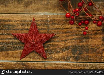 Red Christmas star on a rustic wooden background