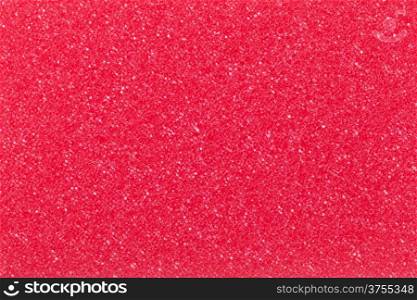 Red cleaning sponge texture for background. Top view