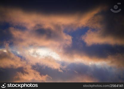 Red clouds in blue sky at sunset in Maui, Hawaii, USA.