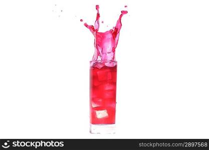 red cocktail splashing into glass and cube of ice