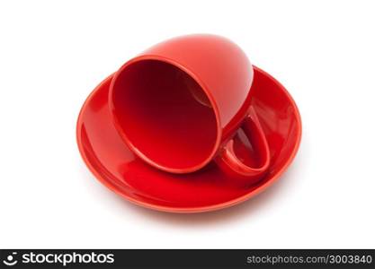 red coffee cup and saucer on a white background