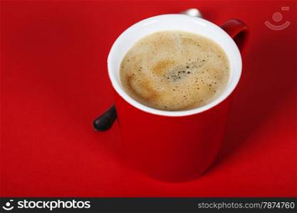 Red coffee cup on red background