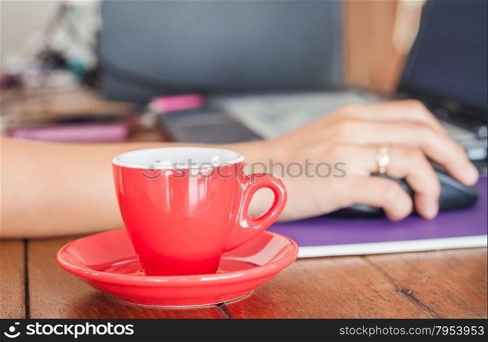 Red coffee cup on work station, stock photo