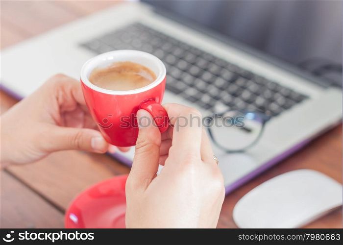Red coffee cup on work station, stock photo