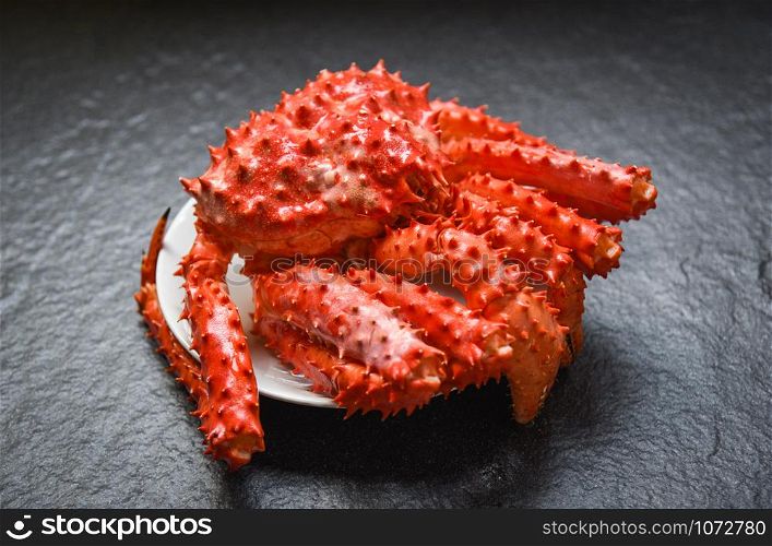 Red crab hokkaido / Alaskan king crab cooked steam or boiled seafood on dark background