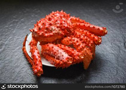 Red crab hokkaido / Alaskan king crab cooked steam or boiled seafood on dark background